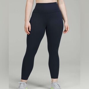 Lululemon Wunder Train High-Rise Tight with Pockets 25" in color True Navy